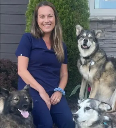 Julie sitting with her dog